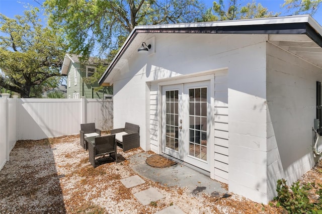 view of patio / terrace with french doors and a fenced backyard