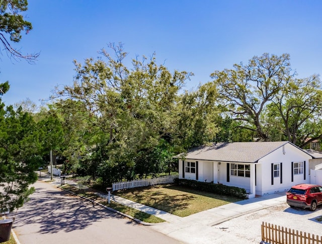 view of front of house featuring fence