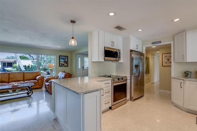 kitchen with visible vents, light stone countertops, stainless steel appliances, white cabinetry, and recessed lighting