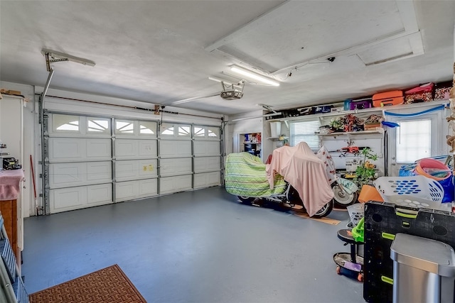 garage featuring a garage door opener