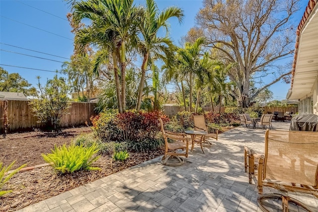 view of patio / terrace with a fenced backyard and outdoor dining space