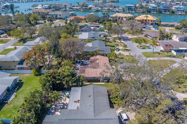 drone / aerial view featuring a residential view and a water view