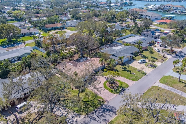 drone / aerial view featuring a water view and a residential view