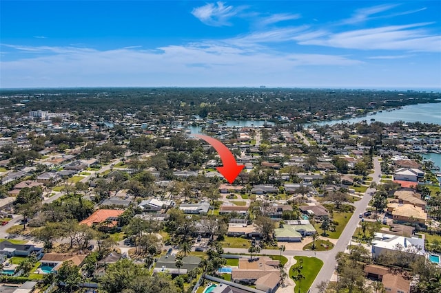 birds eye view of property with a water view and a residential view