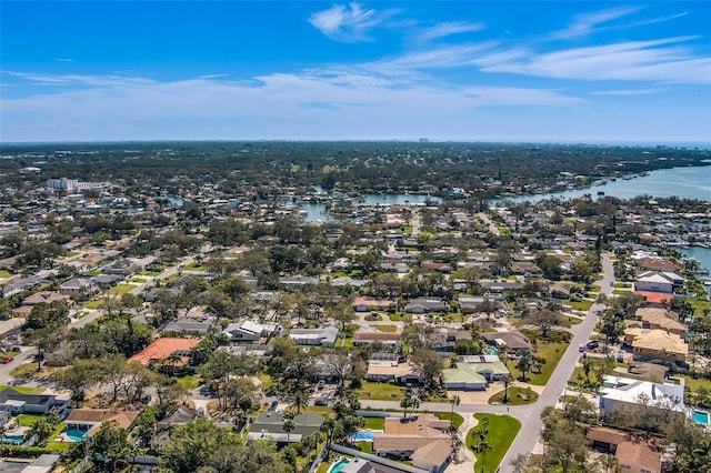 birds eye view of property with a water view and a residential view