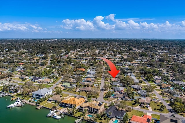 bird's eye view with a residential view and a water view