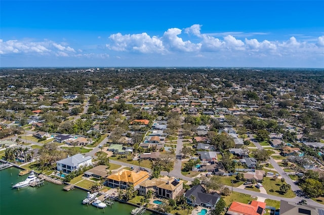 drone / aerial view with a residential view and a water view