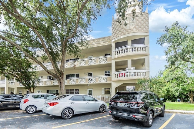 view of property with uncovered parking