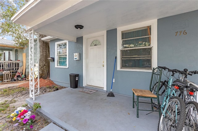 doorway to property with stucco siding