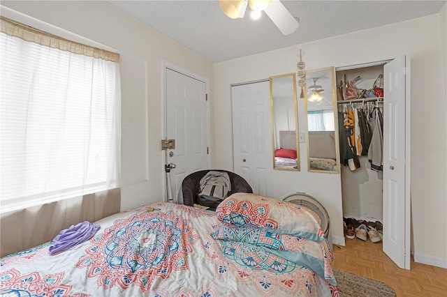 776 18th Ave S, Saint Petersburg, FL 33705 - bedroom with two closets, a ceiling fan, and a textured ceiling