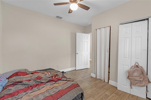 776 18th Ave S, Saint Petersburg, FL 33705 - bedroom featuring multiple closets, baseboards, visible vents, and light wood finished floors