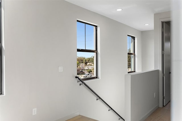 interior space with recessed lighting and an upstairs landing