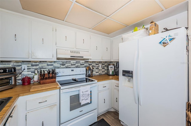 kitchen featuring white appliances, white cabinets, under cabinet range hood, and decorative backsplash