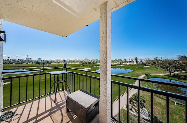 balcony featuring a water view