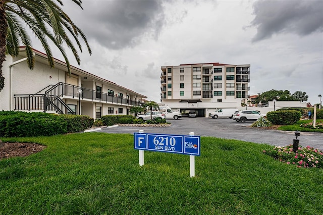 view of property with uncovered parking