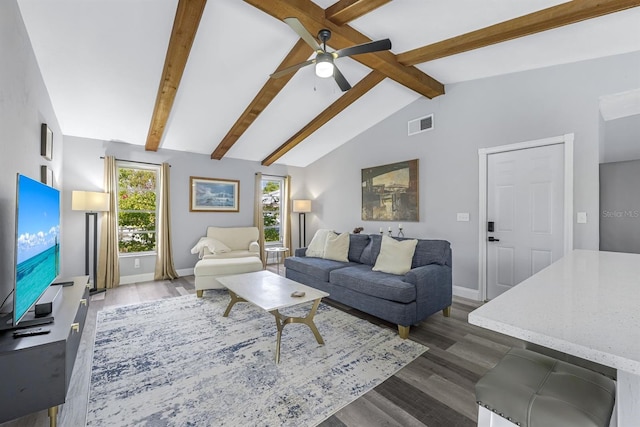 living area with vaulted ceiling with beams, dark wood-style floors, visible vents, and baseboards