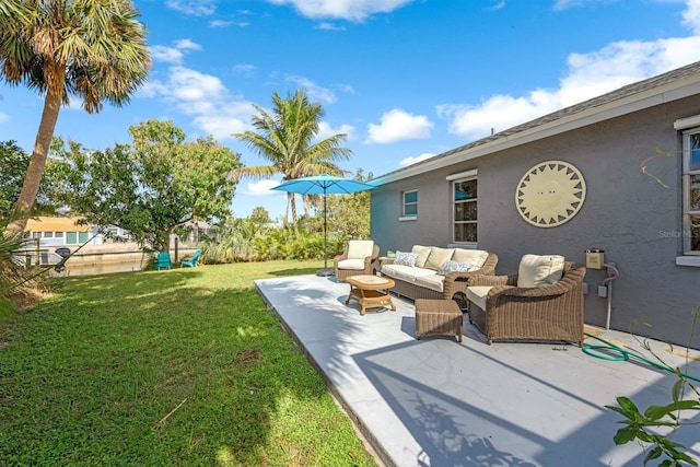 view of yard with a patio, fence, and an outdoor living space