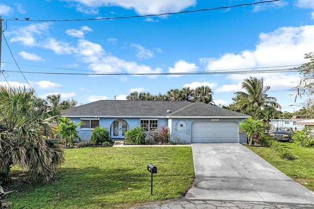 ranch-style home with a garage, concrete driveway, stucco siding, french doors, and a front yard