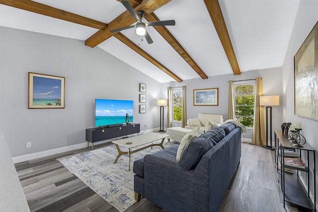 living room featuring vaulted ceiling with beams, wood finished floors, and baseboards