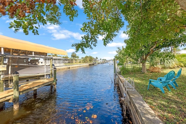 dock area featuring a water view and boat lift