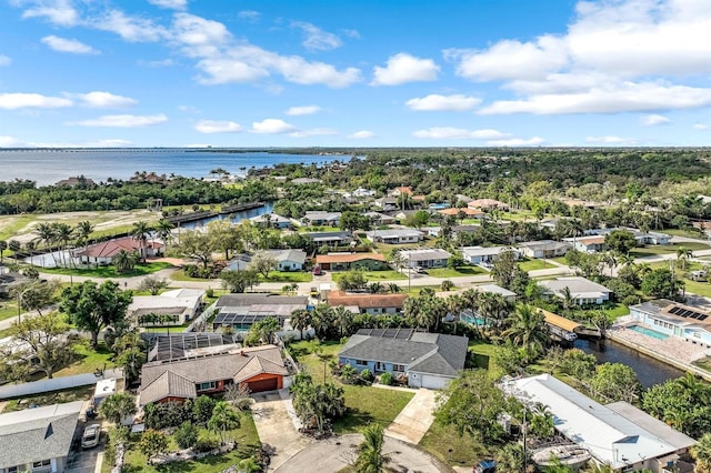 bird's eye view with a water view and a residential view