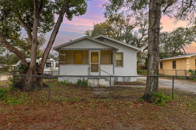 bungalow-style house featuring fence