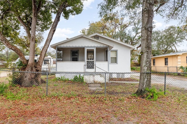 bungalow-style home with fence