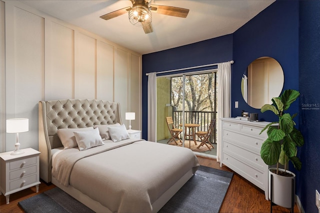 bedroom with access to exterior, a ceiling fan, and dark wood-type flooring