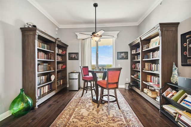 living area with a ceiling fan, baseboards, ornamental molding, and dark wood-style flooring