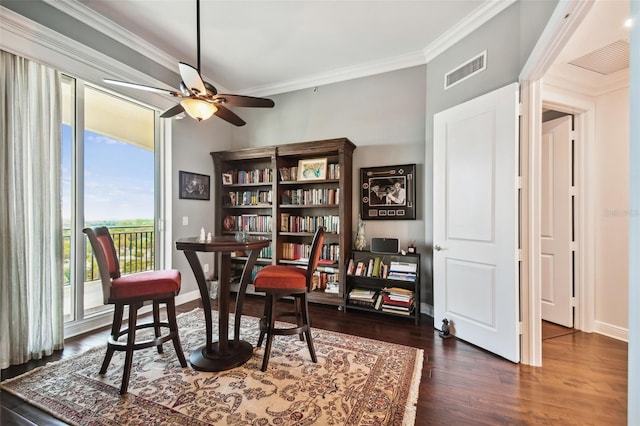 sitting room featuring baseboards, dark wood-style flooring, visible vents, and crown molding