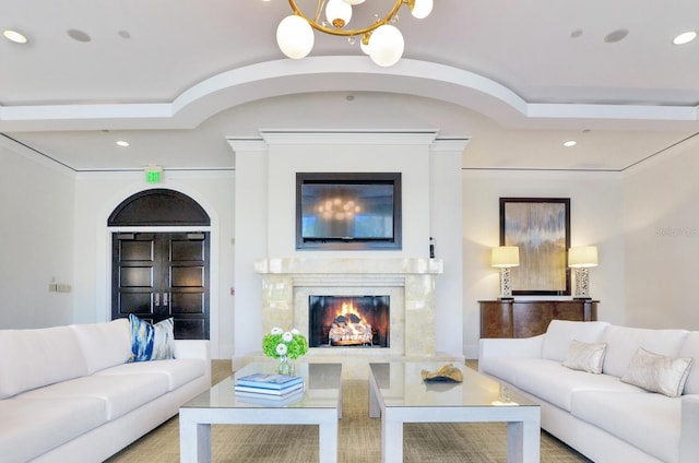 living room featuring a fireplace, an inviting chandelier, and recessed lighting