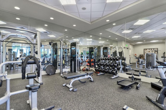 gym featuring a paneled ceiling