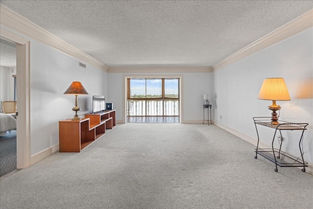 living area with visible vents, light colored carpet, ornamental molding, a textured ceiling, and baseboards