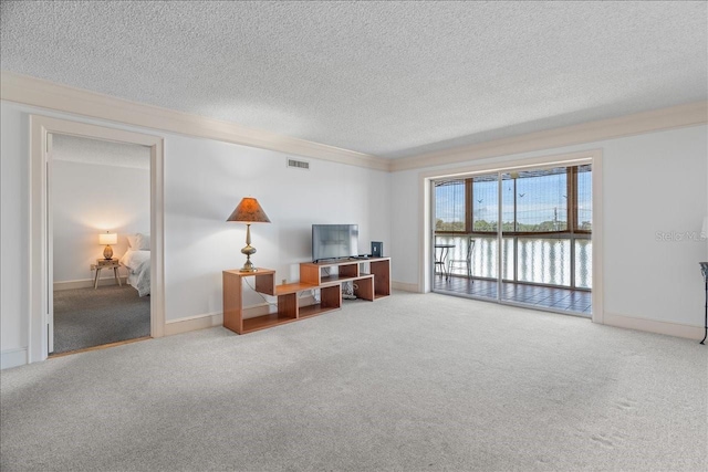 living room featuring carpet floors, baseboards, visible vents, and a textured ceiling