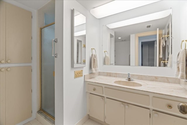 full bathroom featuring visible vents, a stall shower, and vanity