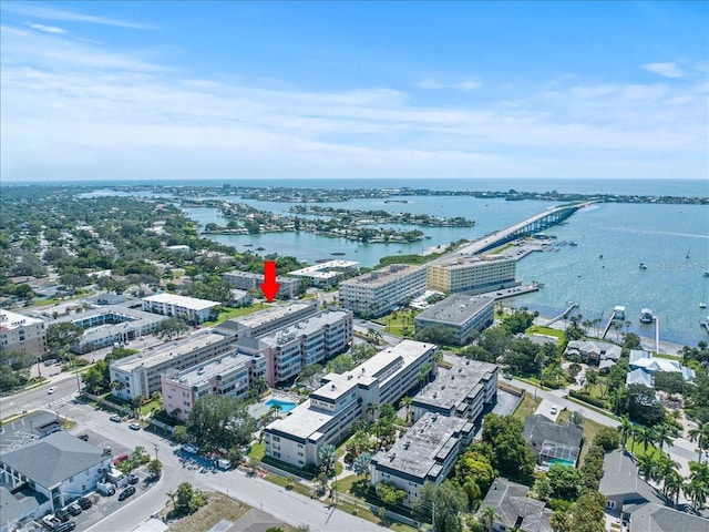 birds eye view of property featuring a water view and a city view