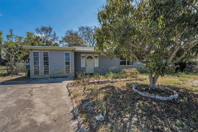 ranch-style house with stucco siding