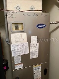 utility room featuring heating unit