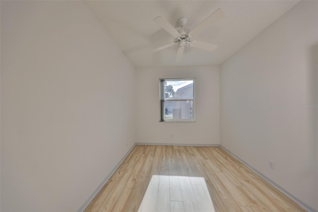 empty room featuring light wood-style flooring and a ceiling fan