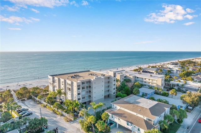 birds eye view of property with a water view and a view of the beach