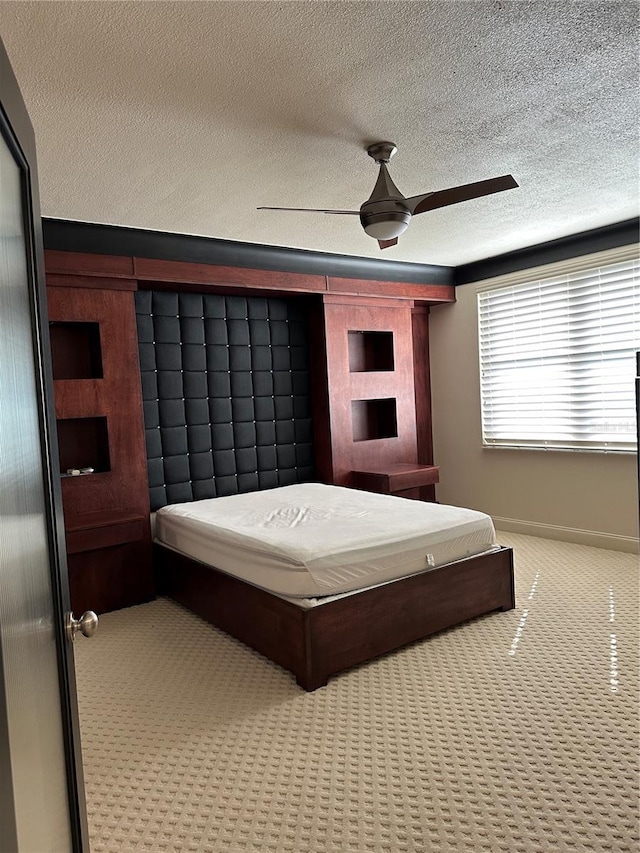 6425 Shoreline Dr Unit 10506, Saint Petersburg, FL 33708 - bedroom with carpet, a textured ceiling, and ceiling fan