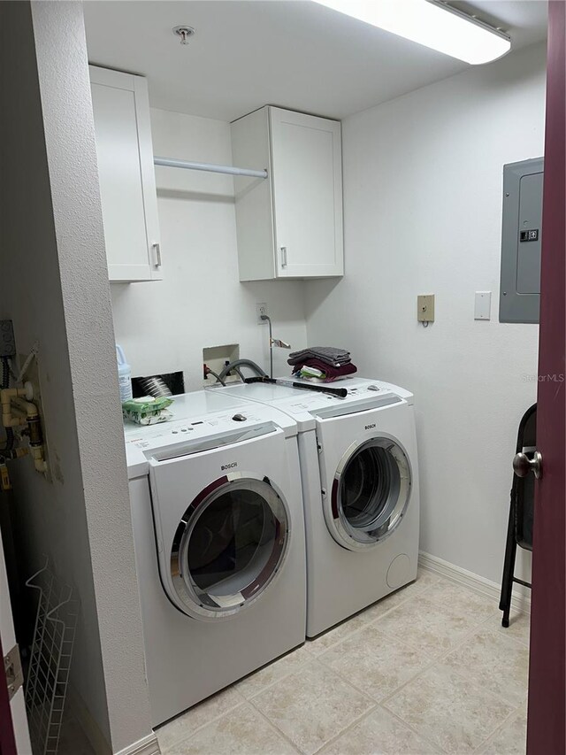 6425 Shoreline Dr Unit 10506, Saint Petersburg, FL 33708 - washroom with electric panel, cabinet space, and washing machine and clothes dryer