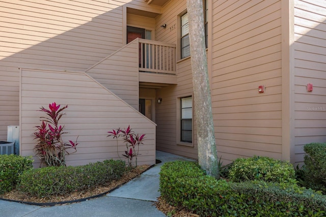 view of side of home featuring a balcony