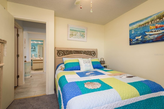 carpeted bedroom with a textured ceiling