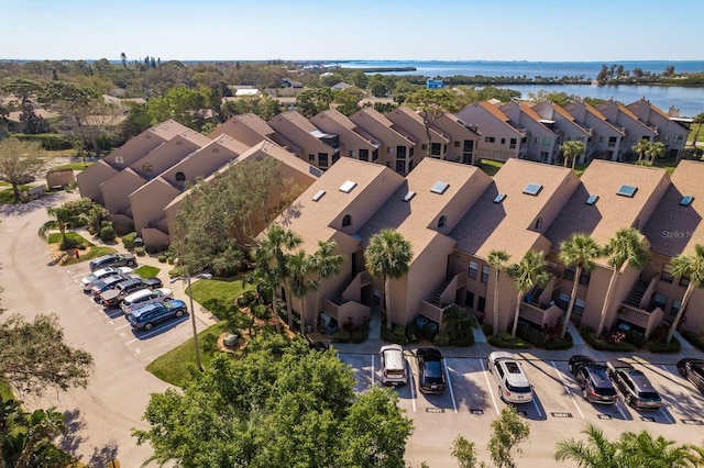 aerial view with a water view and a residential view