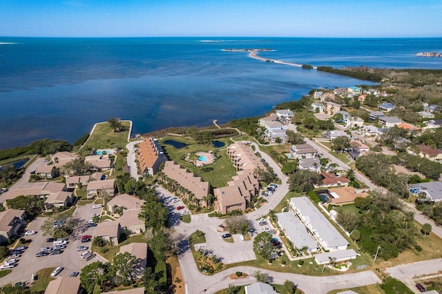 birds eye view of property with a water view and a residential view