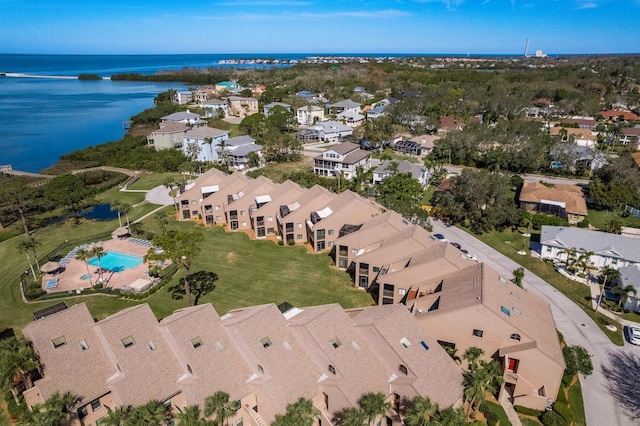 drone / aerial view featuring a residential view and a water view