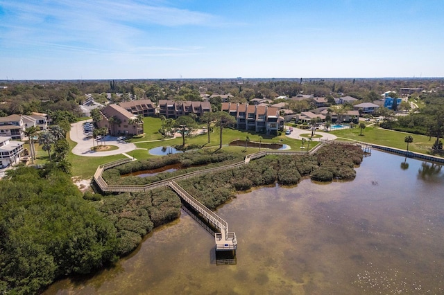 drone / aerial view featuring a residential view and a water view