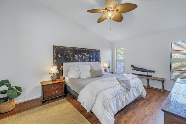 bedroom featuring lofted ceiling, dark wood finished floors, baseboards, and ceiling fan
