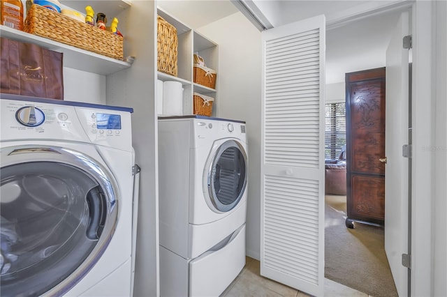 washroom with laundry area, separate washer and dryer, and light colored carpet